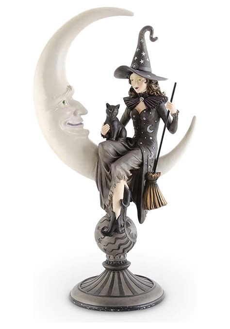 Witch animatronic statue in a seated position